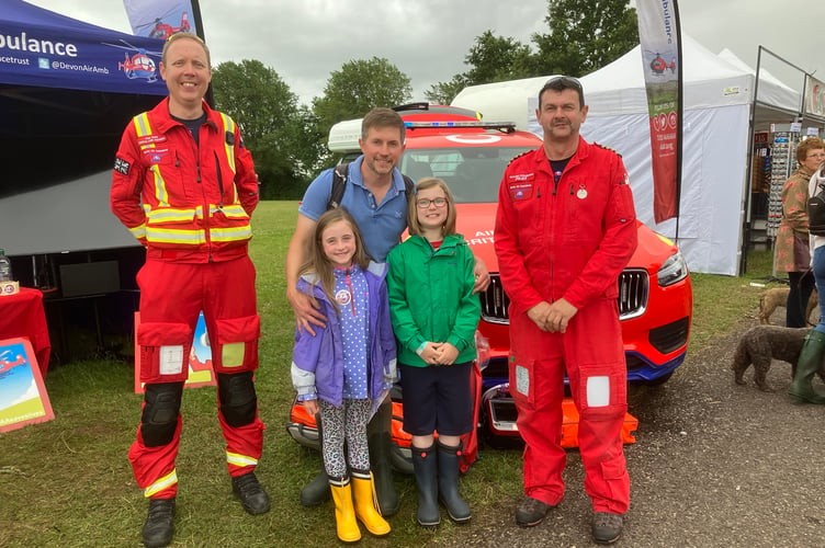 The Newport family Sophie, Megan and Dad Will were delighted to meet Devon Air Ambulance team members pilot Richard Applegarth from Holne, and critical care paramedic Paul White.
Picture Nick Knight july 2021