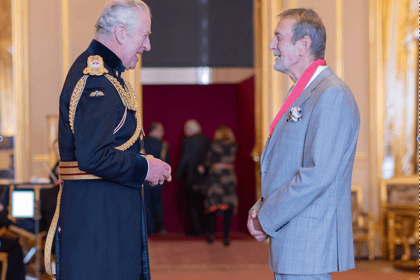 Former CEO presented with CBE in intimate Windsor Castle ceremony 