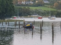 Two rescued as car’s engulfed by incoming tide