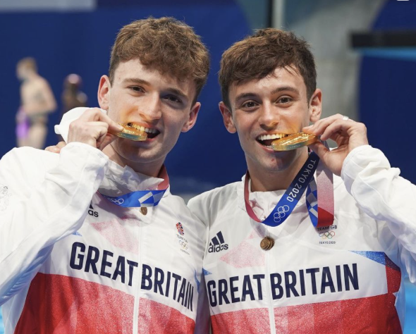 Tom Daley (right) with a gold medal