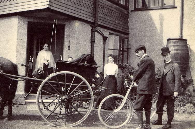 From an album found in attic of Whitehall, Churchstow. People outside house, vicar, bicycle and pony and trap