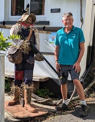 Winner David Bailey with his show-stopping ‘farmer with shotgun at the Hunter’s Lodge’ (that's the one on the left - Ed)