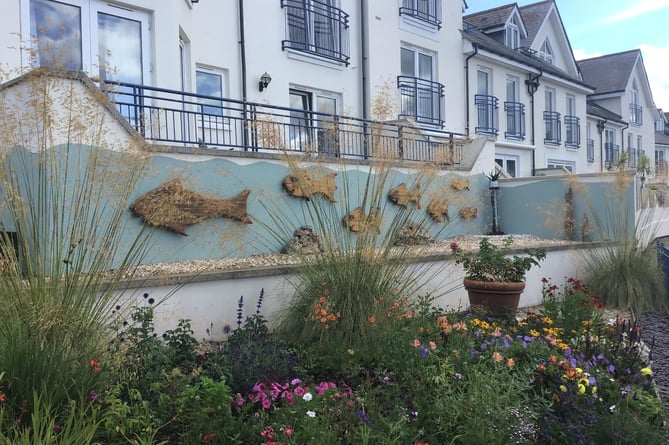 The wooden sculptures were installed on an external wall adjoining the Moorings Reach estate 