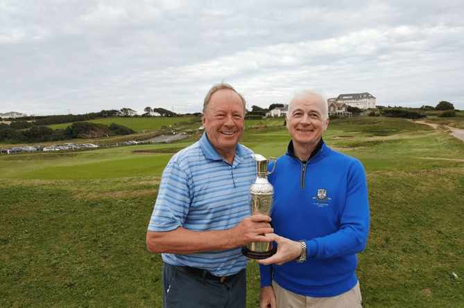 Don Thomson receiving the winning Trophy from Club Captain, Jim Stewart