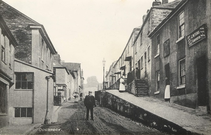 Church Street, Kingsbridge. 
Man standing in the middle of the road.
This area was originally known as Dodbrooke.