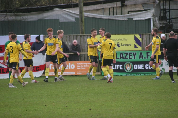 Buckland players celebrate Jared Lewington's first of the afternoon