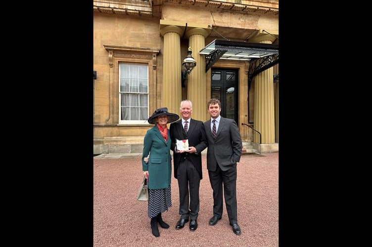 Mark with wife Hazel and son Tom at Buckingham Palace