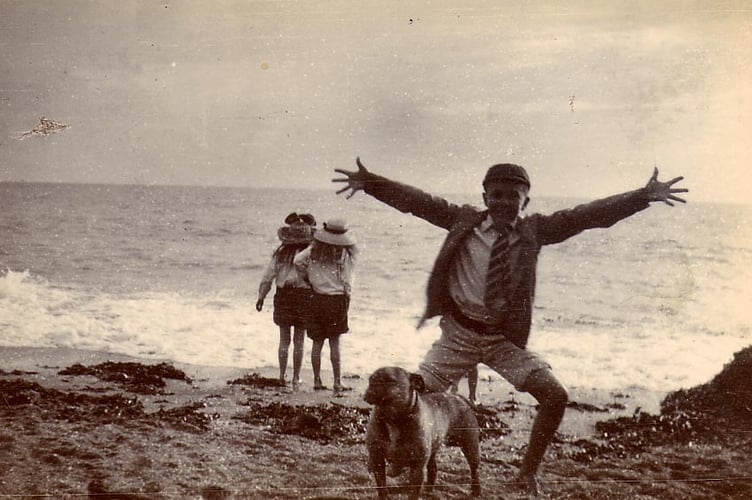 From album found at Whitehall, Churchstow. Children and dog on beach, Blackpool Sands?